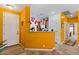 Inviting foyer featuring bright yellow walls, white trim, and an arched doorway to the main living space at 31716 N Poncho Ln, San Tan Valley, AZ 85143