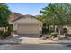 Charming single-story home with a well-manicured lawn and a two-car garage in a desirable neighborhood at 31716 N Poncho Ln, San Tan Valley, AZ 85143