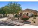 Charming single-story home featuring a well-manicured yard, desert landscaping and a two car garage at 31716 N Poncho Ln, San Tan Valley, AZ 85143