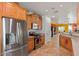 Bright kitchen with stainless steel refrigerator and modern appliances at 31716 N Poncho Ln, San Tan Valley, AZ 85143