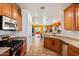 Well-lit kitchen with stainless steel appliances and ample countertop space at 31716 N Poncho Ln, San Tan Valley, AZ 85143