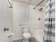 Full bathroom featuring a shower with a shower curtain, a toilet, and a towel rack at 3358 W Sandra Ter, Phoenix, AZ 85053