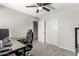 Bright bedroom featuring neutral walls, carpet flooring, walk-in closet, and a stylish work-from-home set up at 3358 W Sandra Ter, Phoenix, AZ 85053