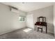 Bright bedroom featuring neutral walls, carpeted floors, and a make up table at 3358 W Sandra Ter, Phoenix, AZ 85053