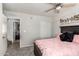 Comfortable bedroom providing a bed, ceiling fan, closet, and seamless access to the living spaces at 3358 W Sandra Ter, Phoenix, AZ 85053