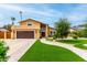 Charming two-story home with a well-manicured front yard and a two-car garage at 3358 W Sandra Ter, Phoenix, AZ 85053