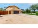 Two-story home with a brown garage door, gated driveway, and landscaped front yard at 3358 W Sandra Ter, Phoenix, AZ 85053