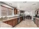 Spacious kitchen with stainless steel appliances, granite counters, and view of the dining area at 3358 W Sandra Ter, Phoenix, AZ 85053