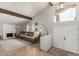 Bright living room with vaulted ceilings, a cozy fireplace and a view of the front entry at 3358 W Sandra Ter, Phoenix, AZ 85053