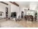 Bright and airy living room with dining area, TV, stairs, and lots of natural light at 3358 W Sandra Ter, Phoenix, AZ 85053