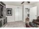 Versatile living area showcasing built-in shelving, a closet, and convenient access to other areas of the home at 3358 W Sandra Ter, Phoenix, AZ 85053