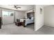 Relaxing main bedroom offering a cozy bed, a modern AC unit, and a window for natural light at 3358 W Sandra Ter, Phoenix, AZ 85053