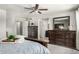 The main bedroom features a ceiling fan, lots of closet space, and an ensuite bathroom at 3358 W Sandra Ter, Phoenix, AZ 85053