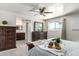 The main bedroom boasts a ceiling fan, a window with beautiful views, and an ensuite bathroom at 3358 W Sandra Ter, Phoenix, AZ 85053