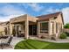 The covered patio includes a barbecue, seating and is a perfect spot for outdoor dining at 3460 N Stone Gully St, Mesa, AZ 85207
