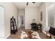 Bright, spacious home office with a desk, shelving, stylish decor, and a comfortable layout for productive work at 3460 N Stone Gully St, Mesa, AZ 85207