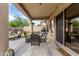Inviting outdoor patio with comfortable seating, a dining table, a grill, and a great spot for relaxing at 3460 N Stone Gully St, Mesa, AZ 85207
