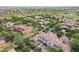 Aerial view of the property featuring a backyard, multiple seating areas, and lush greenery at 3521 N Hooper St, Buckeye, AZ 85396