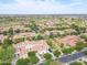 An aerial view showcases the expansive community and surrounding area at 3521 N Hooper St, Buckeye, AZ 85396