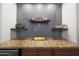 Close-up view of the bar area featuring a granite countertop and tile backsplash at 3521 N Hooper St, Buckeye, AZ 85396