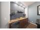 Close-up view of the bar area with a beverage center and stylish decor at 3521 N Hooper St, Buckeye, AZ 85396