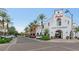 Shopping center featuring a variety of shops, palm trees, well-maintained landscaping, and ample parking at 3521 N Hooper St, Buckeye, AZ 85396