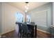 Open-concept dining area with view to the living area and arched doorways at 3521 N Hooper St, Buckeye, AZ 85396