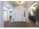 Inviting entryway with hardwood floors and a view into the adjacent dining and living areas at 3521 N Hooper St, Buckeye, AZ 85396