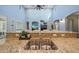 Kitchen sink overlooking a living area with a fireplace and abundant natural light at 3521 N Hooper St, Buckeye, AZ 85396