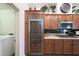 Kitchen featuring stainless steel appliances and a wine refrigerator near wood cabinets at 3521 N Hooper St, Buckeye, AZ 85396