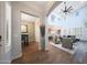 Open-concept layout showcasing the living room with high ceilings and seamless flow into the dining area at 3521 N Hooper St, Buckeye, AZ 85396