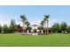 Picturesque park entrance with manicured lawns, mature trees, and charming architecture creating a serene atmosphere at 3521 N Hooper St, Buckeye, AZ 85396