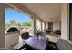 A comfortable patio with a seating area, table, grill and views to the backyard at 3521 N Hooper St, Buckeye, AZ 85396