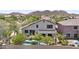 Aerial view of a home with a pool, patio, and lush landscaping at 35746 N 32Nd Ln, Phoenix, AZ 85086