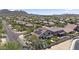 Stunning aerial view of a home with a pool and solar panels in a beautiful desert neighborhood at 35746 N 32Nd Ln, Phoenix, AZ 85086