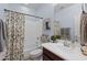 Well-lit bathroom with a shower-tub combination and stylish vanity at 35746 N 32Nd Ln, Phoenix, AZ 85086