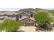 Charming home with a two-car garage and desert landscaping surrounded by mature trees at 35746 N 32Nd Ln, Phoenix, AZ 85086