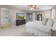 Comfortable main bedroom with plush carpet, golf course view, and ensuite bathroom at 35746 N 32Nd Ln, Phoenix, AZ 85086