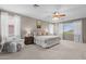 Spacious main bedroom featuring a decorative ceiling fan, lots of natural light and neutral decor at 35746 N 32Nd Ln, Phoenix, AZ 85086