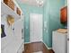 Organized mud room with storage, seating, and charming light fixture at 35746 N 32Nd Ln, Phoenix, AZ 85086