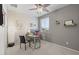 Bright home office featuring a comfortable desk, decor shelves, and lots of natural light at 35746 N 32Nd Ln, Phoenix, AZ 85086