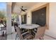Covered patio with a dining table and chairs, ideal for outdoor meals at 35746 N 32Nd Ln, Phoenix, AZ 85086