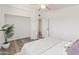 Bright bedroom features a ceiling fan, natural light, and wood-look floors at 3824 W Puget Ave, Phoenix, AZ 85051
