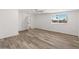 Large bedroom with wood-look flooring and ample natural light at 3824 W Puget Ave, Phoenix, AZ 85051