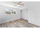 This bedroom features a window and wood-look flooring at 3824 W Puget Ave, Phoenix, AZ 85051
