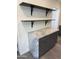 Kitchen counter with modern marble tops, gray cabinets, and open shelving at 3824 W Puget Ave, Phoenix, AZ 85051