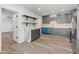 Open-concept kitchen with gray cabinets, stainless steel appliances, and eat-in breakfast area at 3824 W Puget Ave, Phoenix, AZ 85051