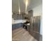 Modern kitchen features stainless steel appliances, gray cabinetry, and a stylish backsplash at 3824 W Puget Ave, Phoenix, AZ 85051