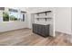 Bright kitchen with stainless appliances, gray cabinets, and large window at 3824 W Puget Ave, Phoenix, AZ 85051