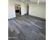 A spacious living room featuring hard surface floors and recessed lighting at 3824 W Puget Ave, Phoenix, AZ 85051